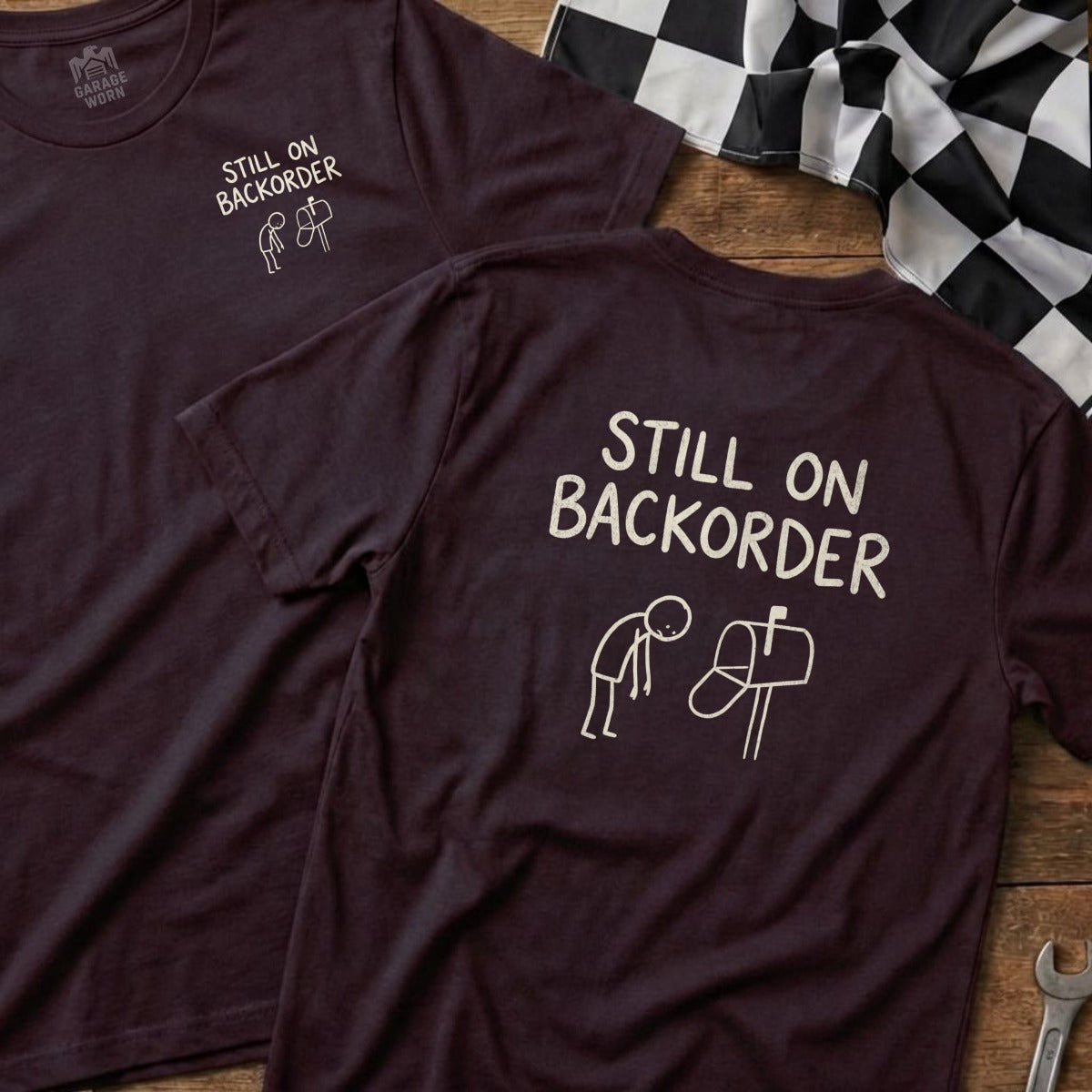 Two maroon t-shirts with "Still on Backorder" text and a stick figure at a mailbox.