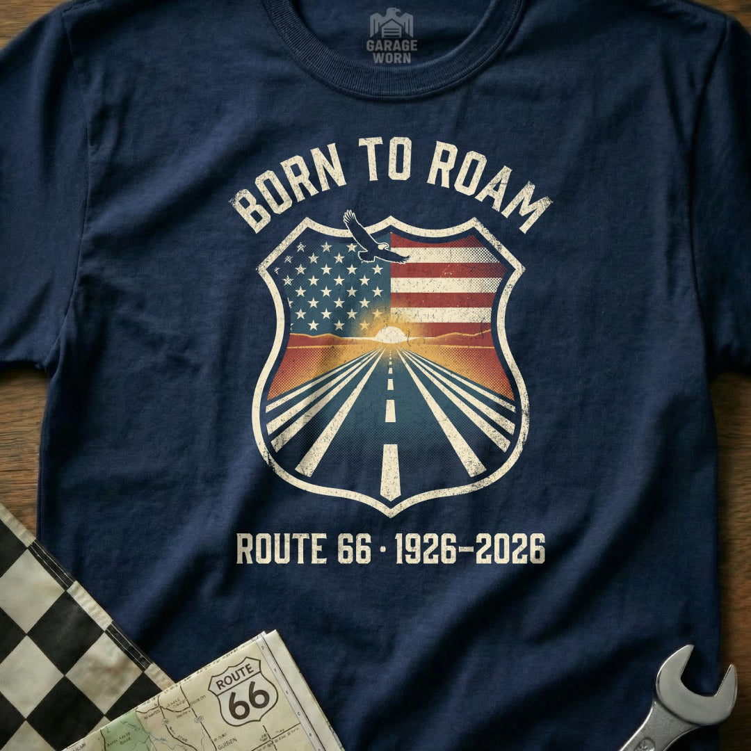 Born to Roam Route 66 1926-2026 graphic on a navy t-shirt.