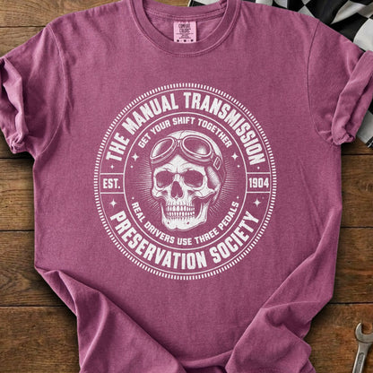 T-shirt with skull, goggles, and text "Manual Transmission Preservation Society".