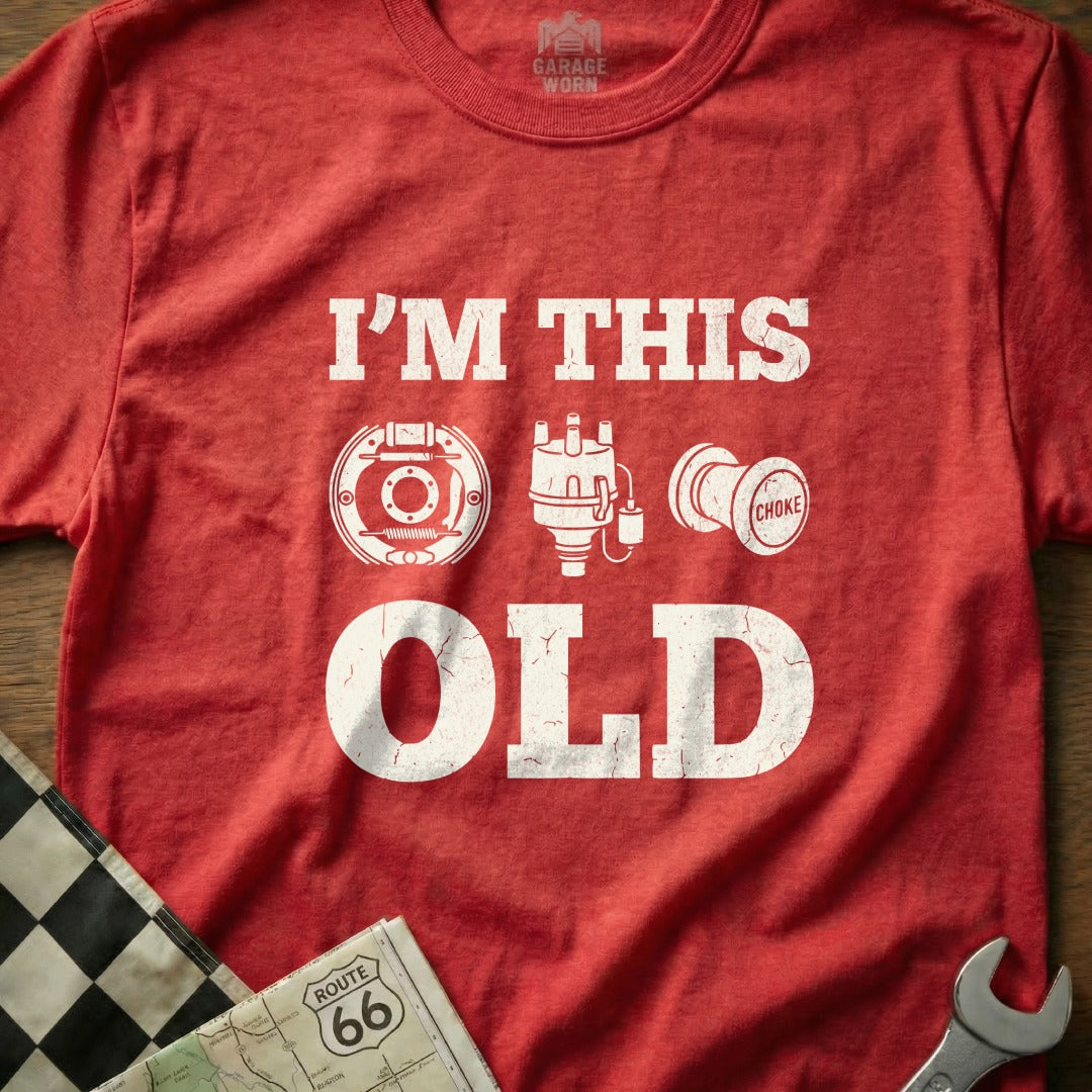 Red t-shirt with "I'M THIS OLD" and car parts graphic.