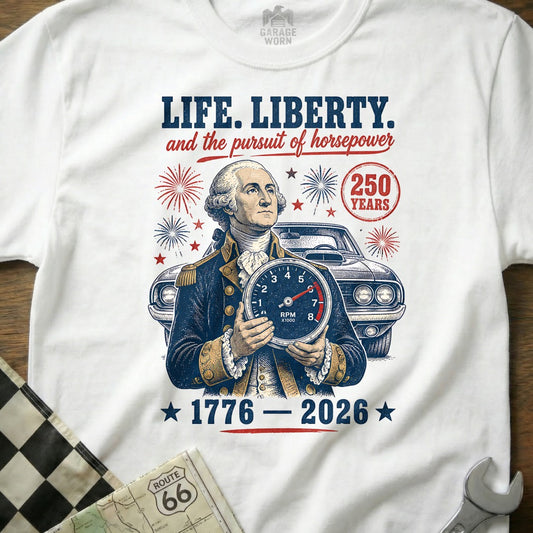 George Washington holding a speedometer with "LIFE. LIBERTY. and the pursuit of horsepower" and "1776-2026".