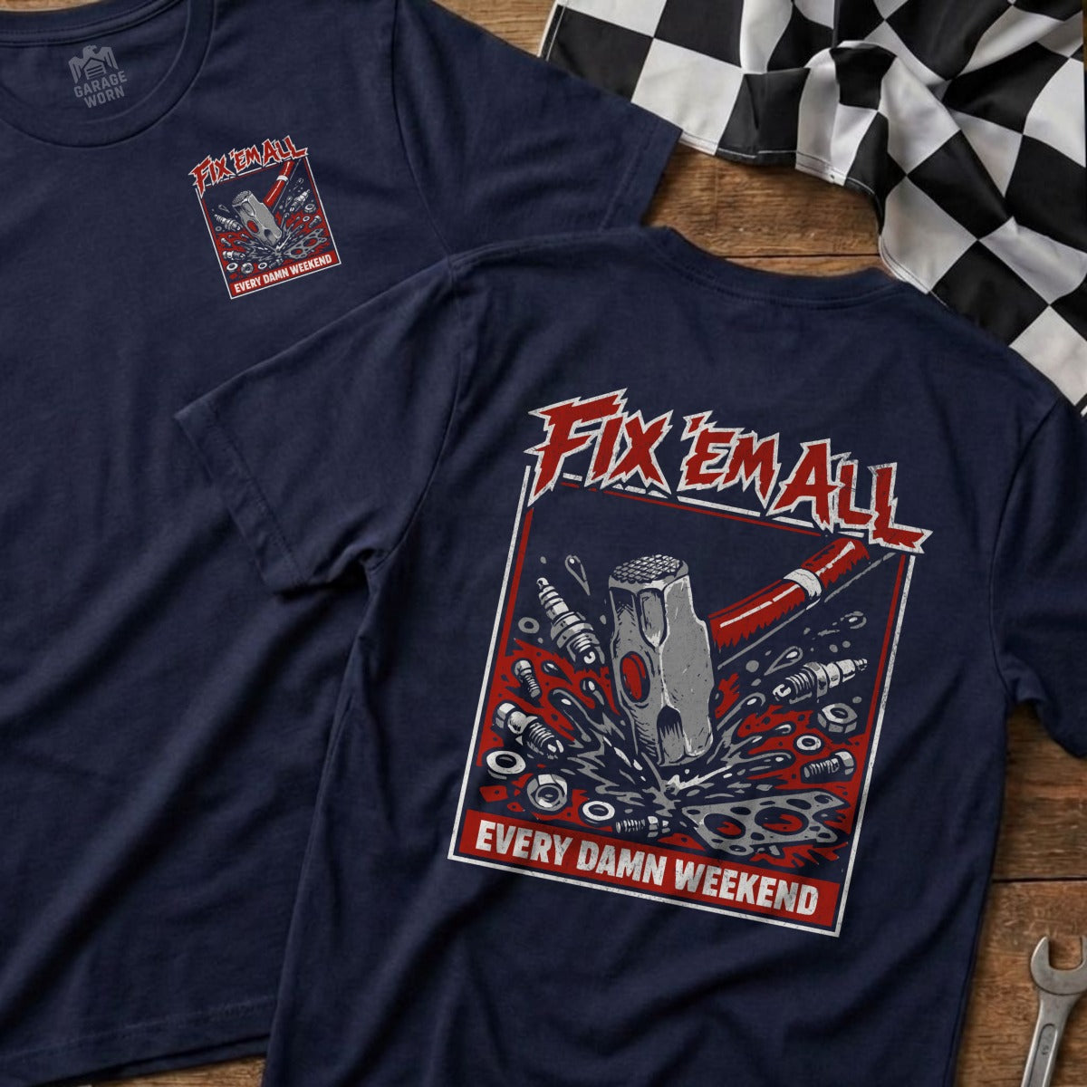 Navy t-shirt with "Fix Em All" and a hammer breaking tools.
