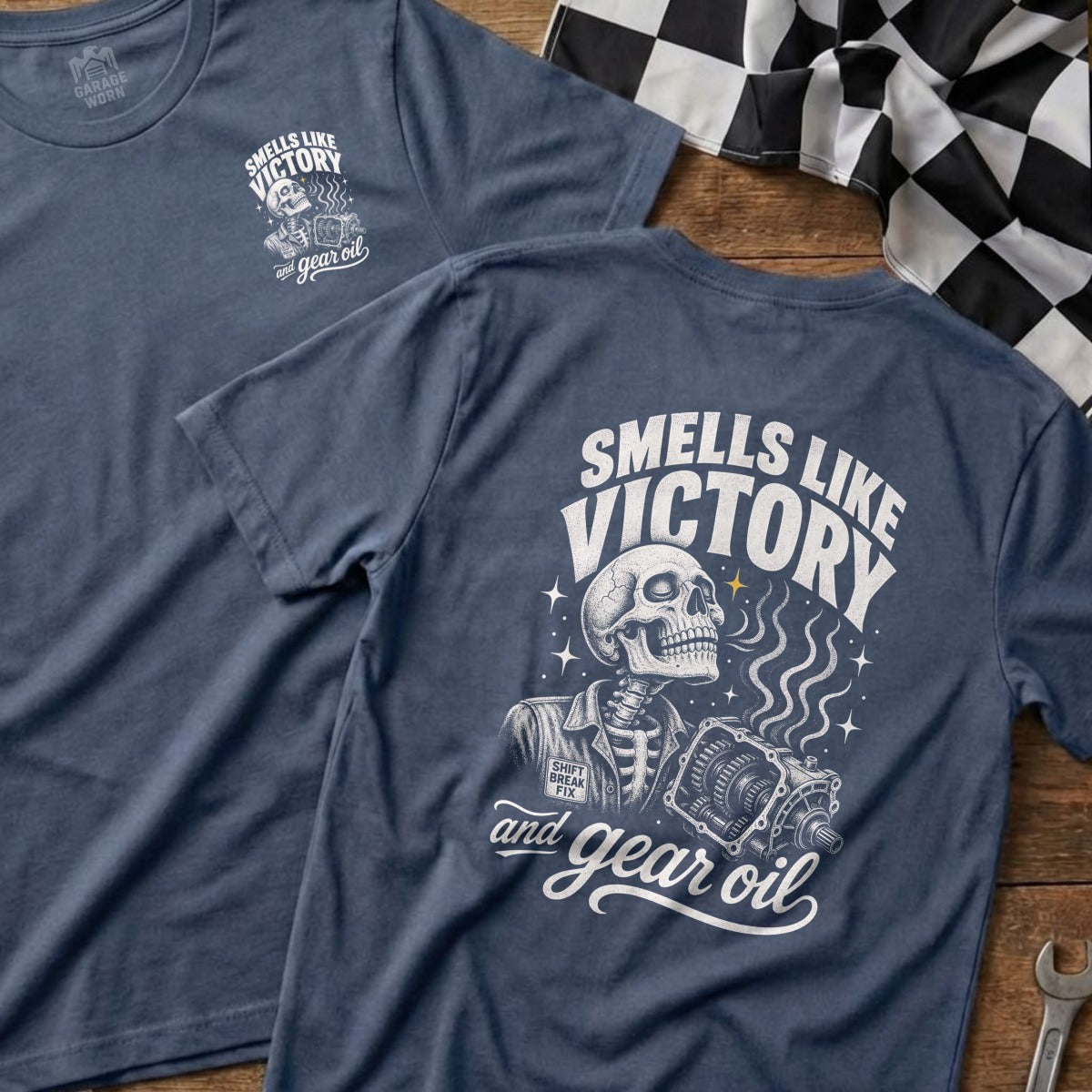 T-shirt with skeleton, gears, and text "Smells like victory and gear oil".
