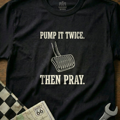 Black t-shirt with white text "PUMP IT TWICE. THEN PRAY." and image of a clutch pedal.