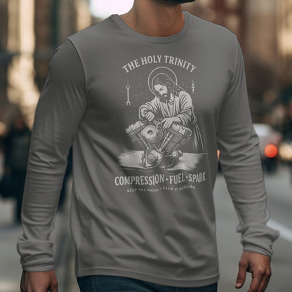 Jesus working on a motorcycle engine with text "Compression Fuel Spark".