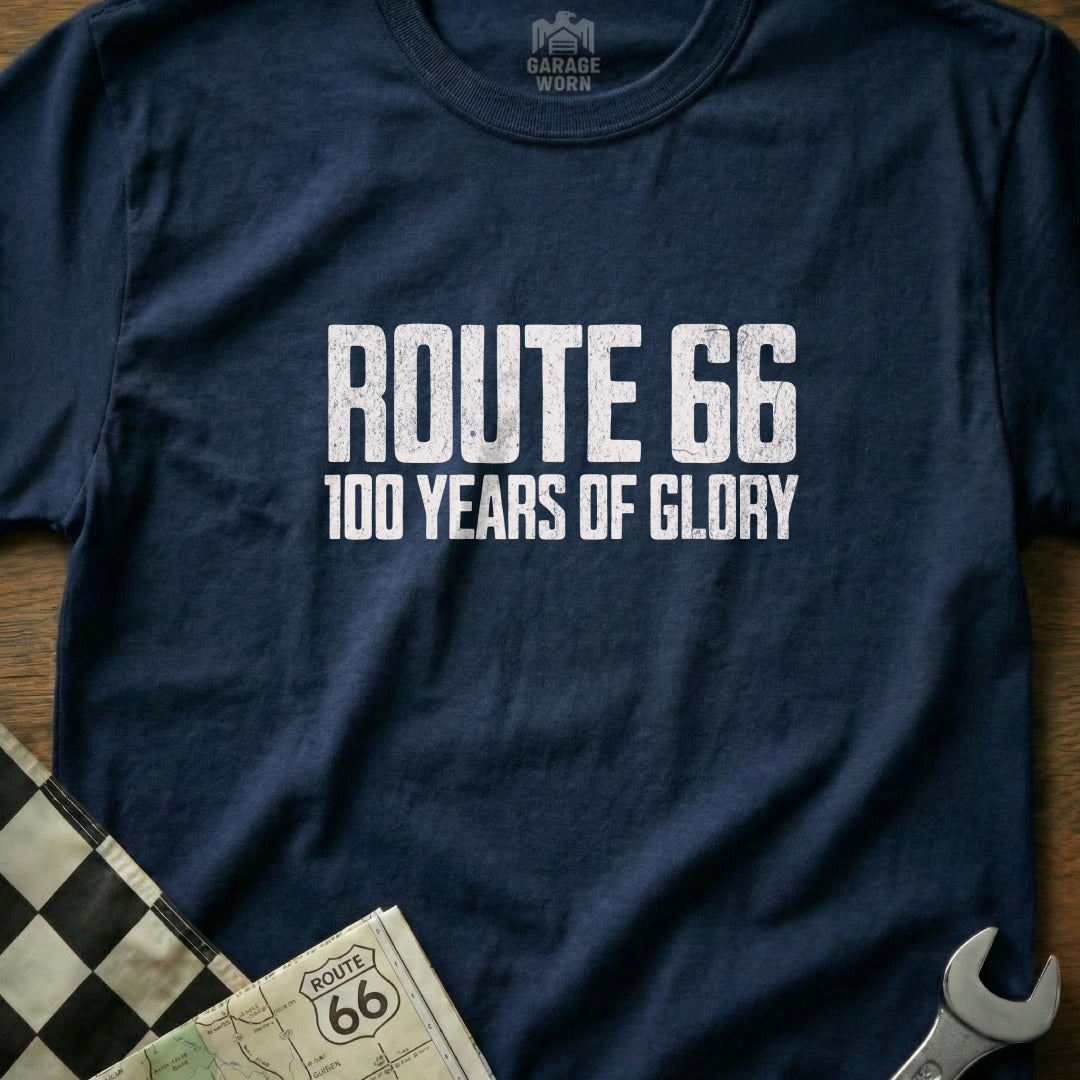 Navy t-shirt with "Route 66 100 Years of Glory" text, near checkered flag.