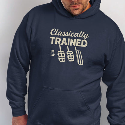 Navy hoodie with "Classically TRAINED" text and manual car pedals graphic.