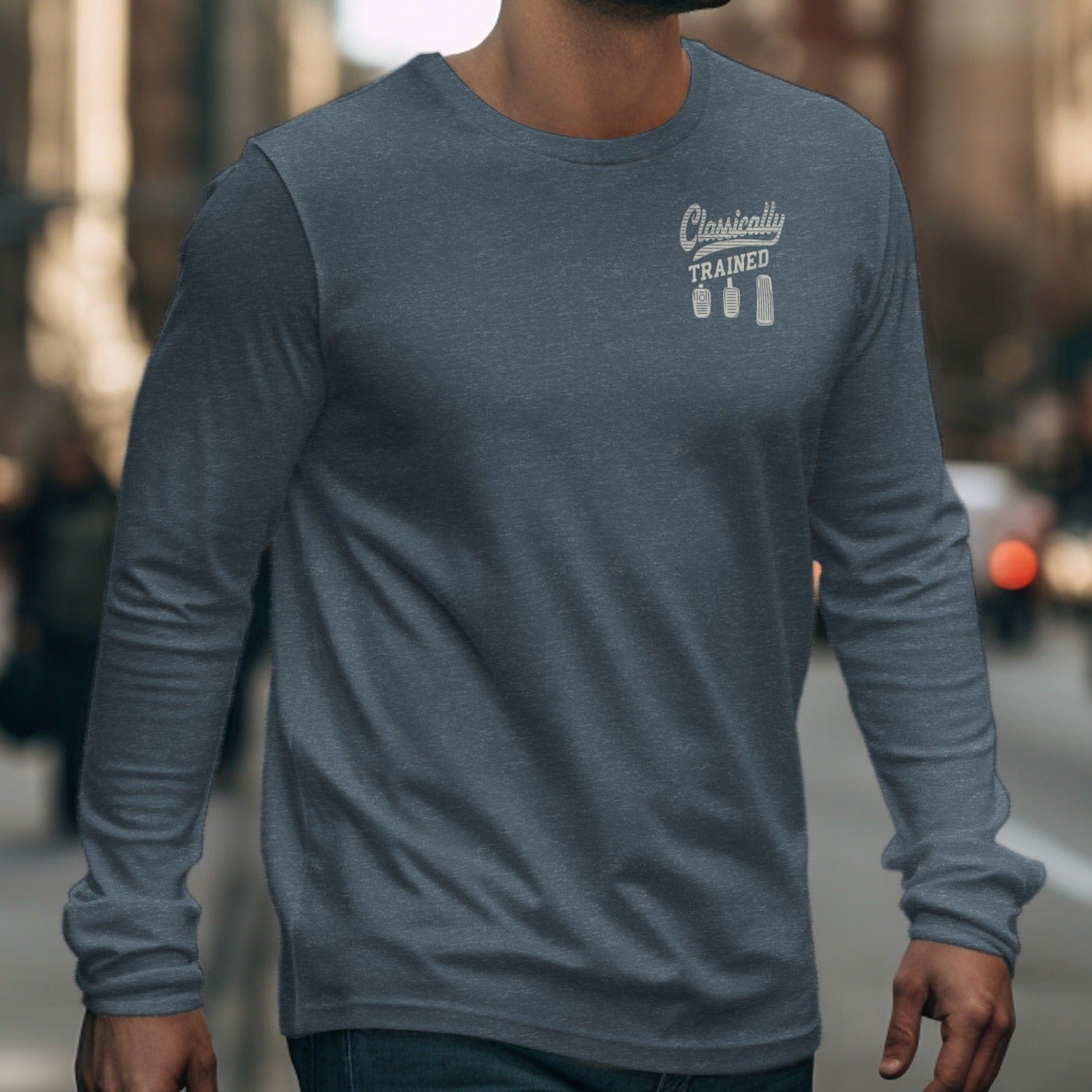 Grey long-sleeve shirt with "Classically TRAINED" and three pedals graphic.