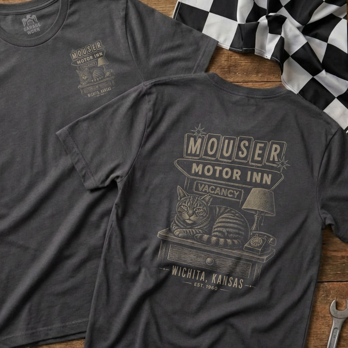 T-shirt with a graphic of a cat on a table, Mouser Motor Inn sign, and "Wichita, Kansas" text.