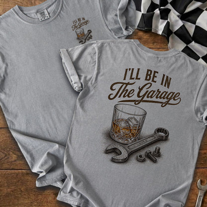 Gray t-shirt with "I'll Be In The Garage" text, whiskey glass, and tools.