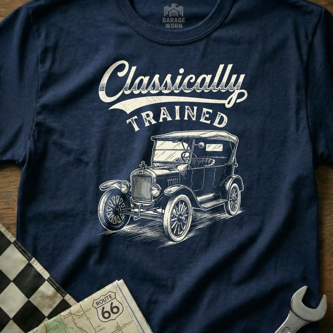 Navy t-shirt with graphic of vintage car and text "Classically TRAINED."