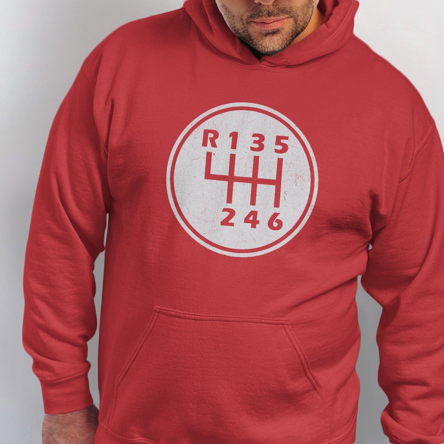 Red hoodie with a white distressed six-gear shift pattern graphic on the chest.