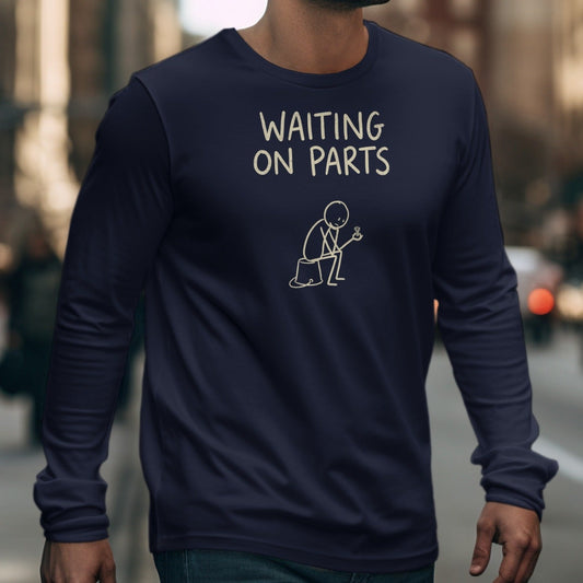 Navy long-sleeve t-shirt with "WAITING ON PARTS" text and a stick figure holding a screw.