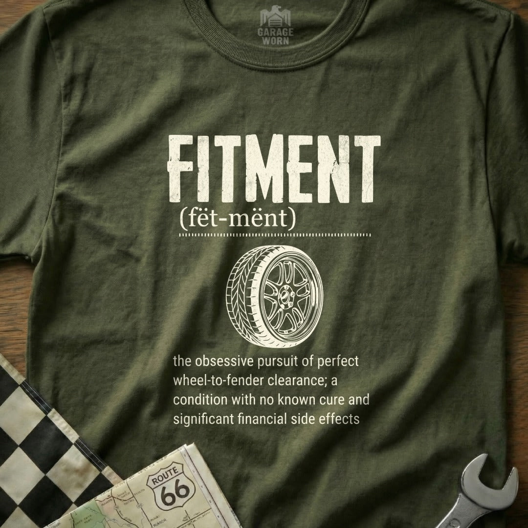 Olive t-shirt with "FITMENT" text, wheel graphic, and definition.