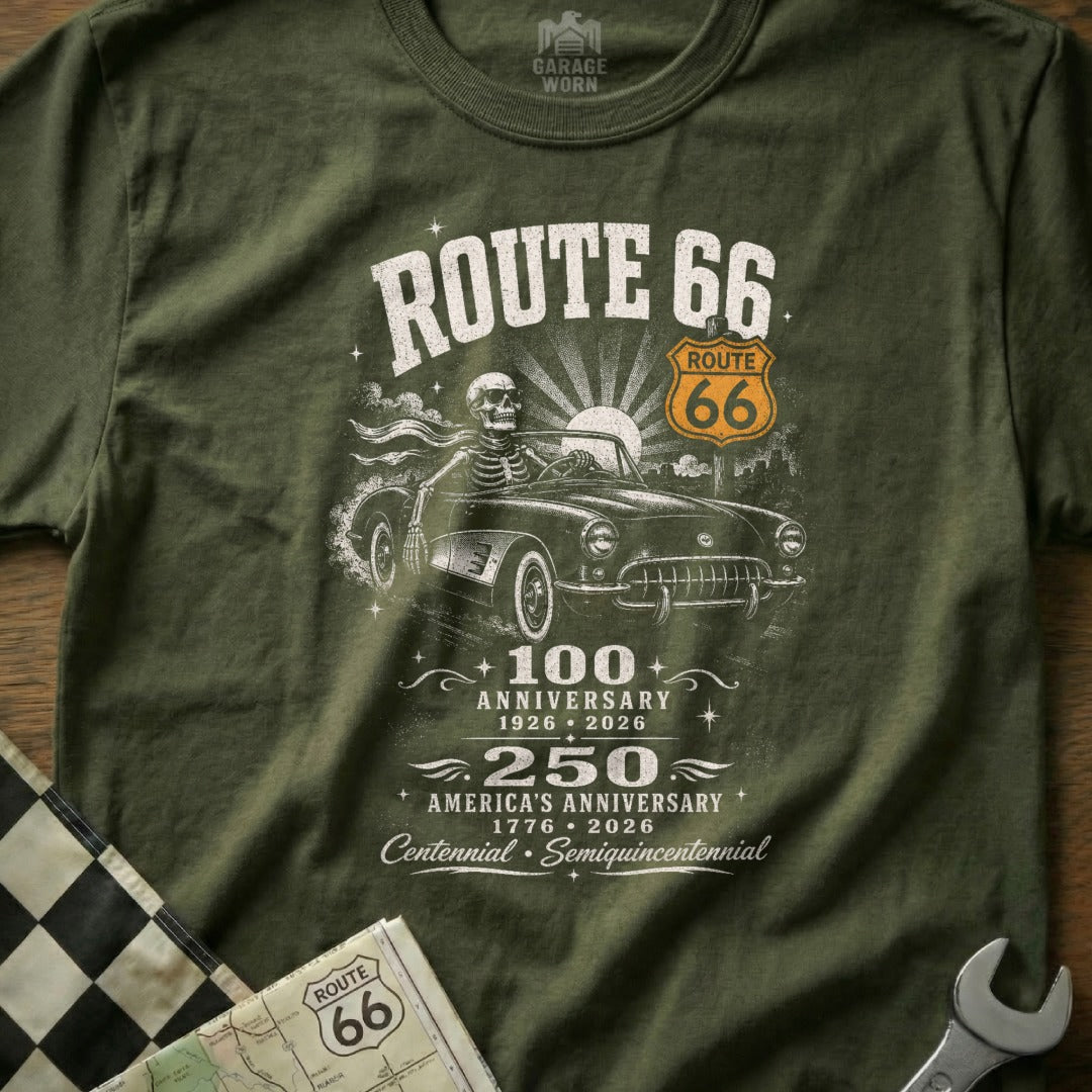 Green t-shirt with Route 66 anniversary graphic featuring a skeleton driving a classic car.