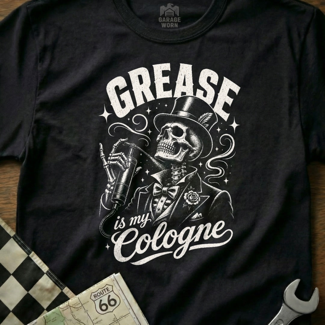 Black t-shirt with skeleton in suit spraying "Grease is my Cologne" on chest.