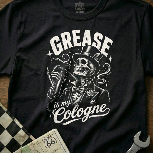 Black t-shirt with skeleton in suit spraying "Grease is my Cologne" on chest.