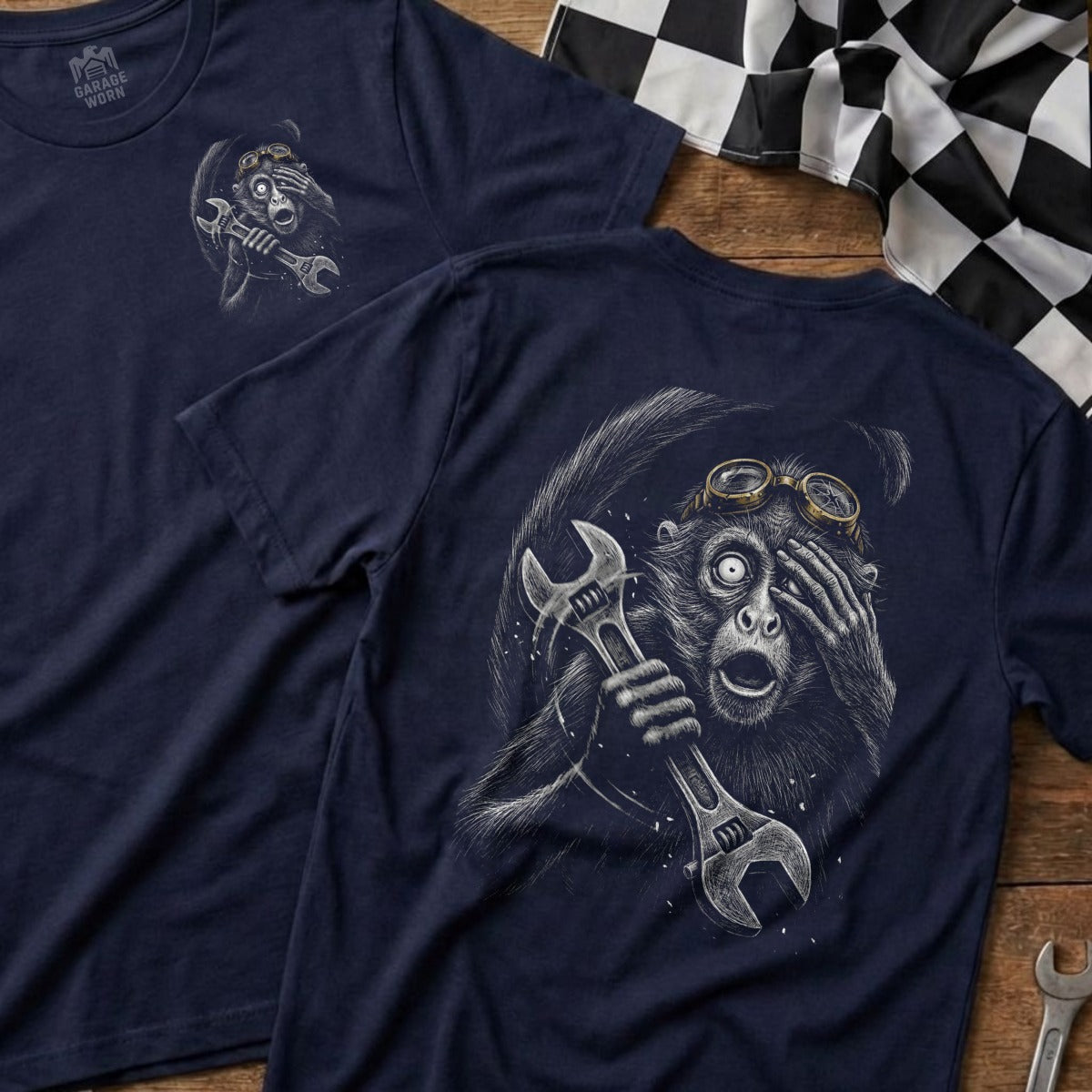 Navy t-shirt with monkey mechanic graphic and wrench.