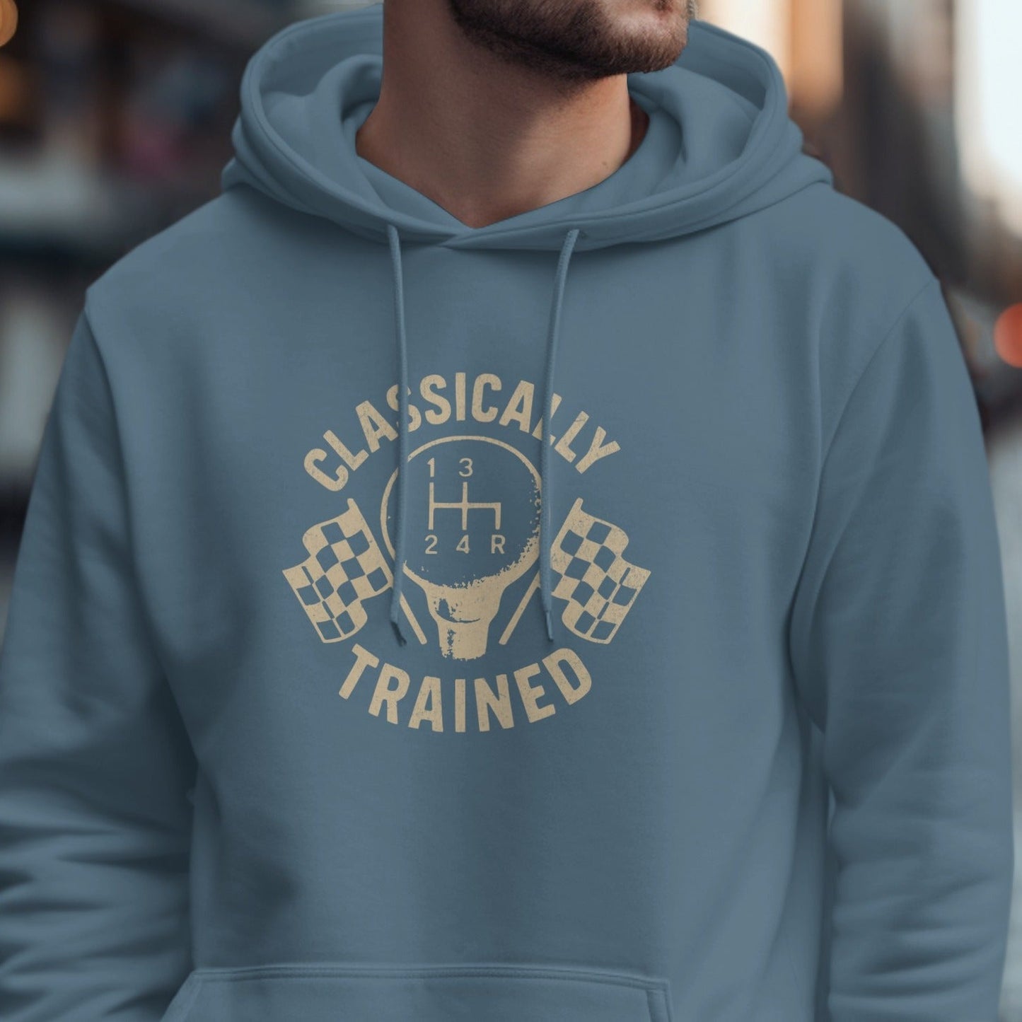 Blue hoodie with "Classically Trained" text and a manual gear shift graphic.