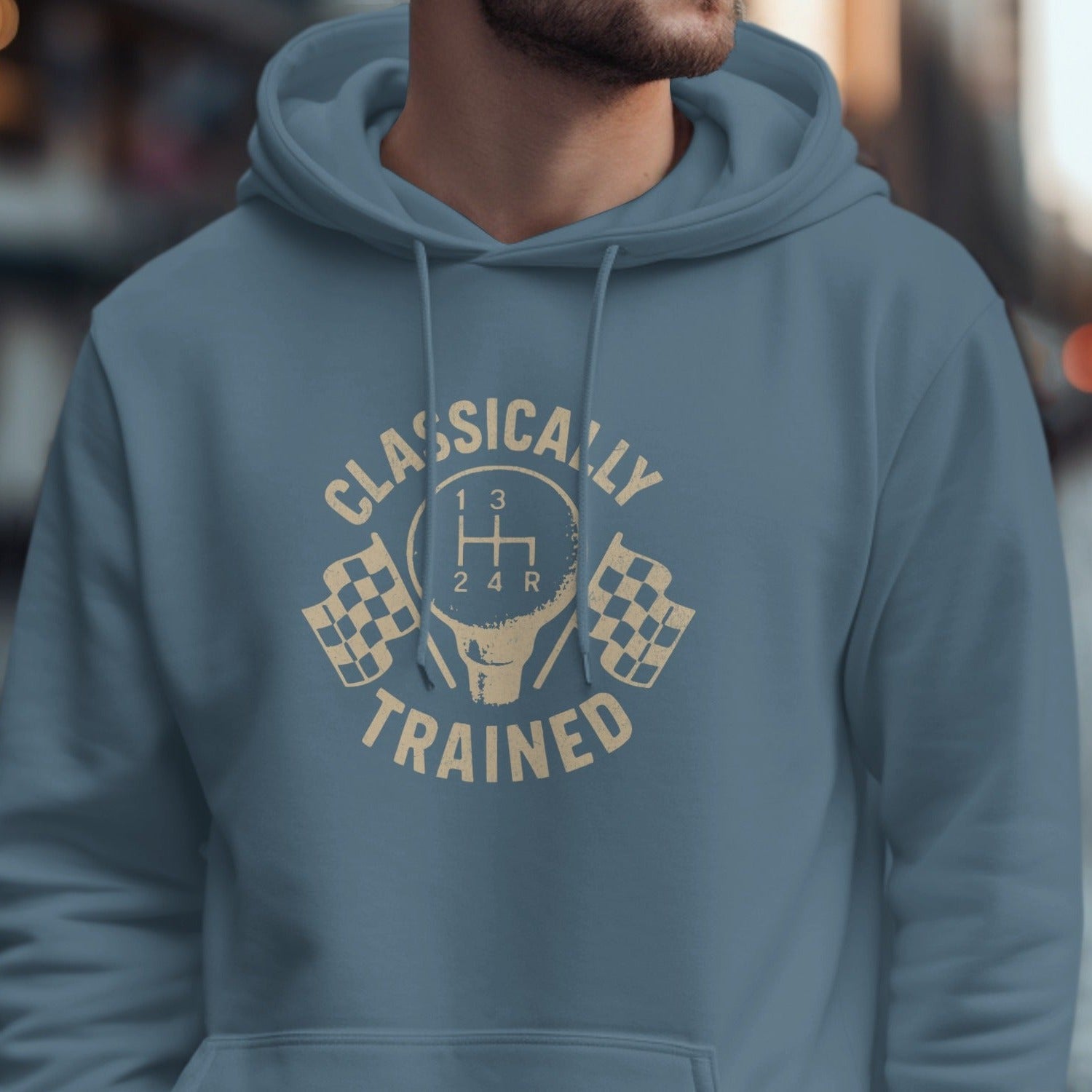 Blue hoodie with "Classically Trained" text and a manual gear shift graphic.