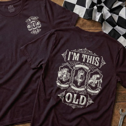 Maroon t-shirt with "I'M THIS OLD" and vintage car parts graphic.