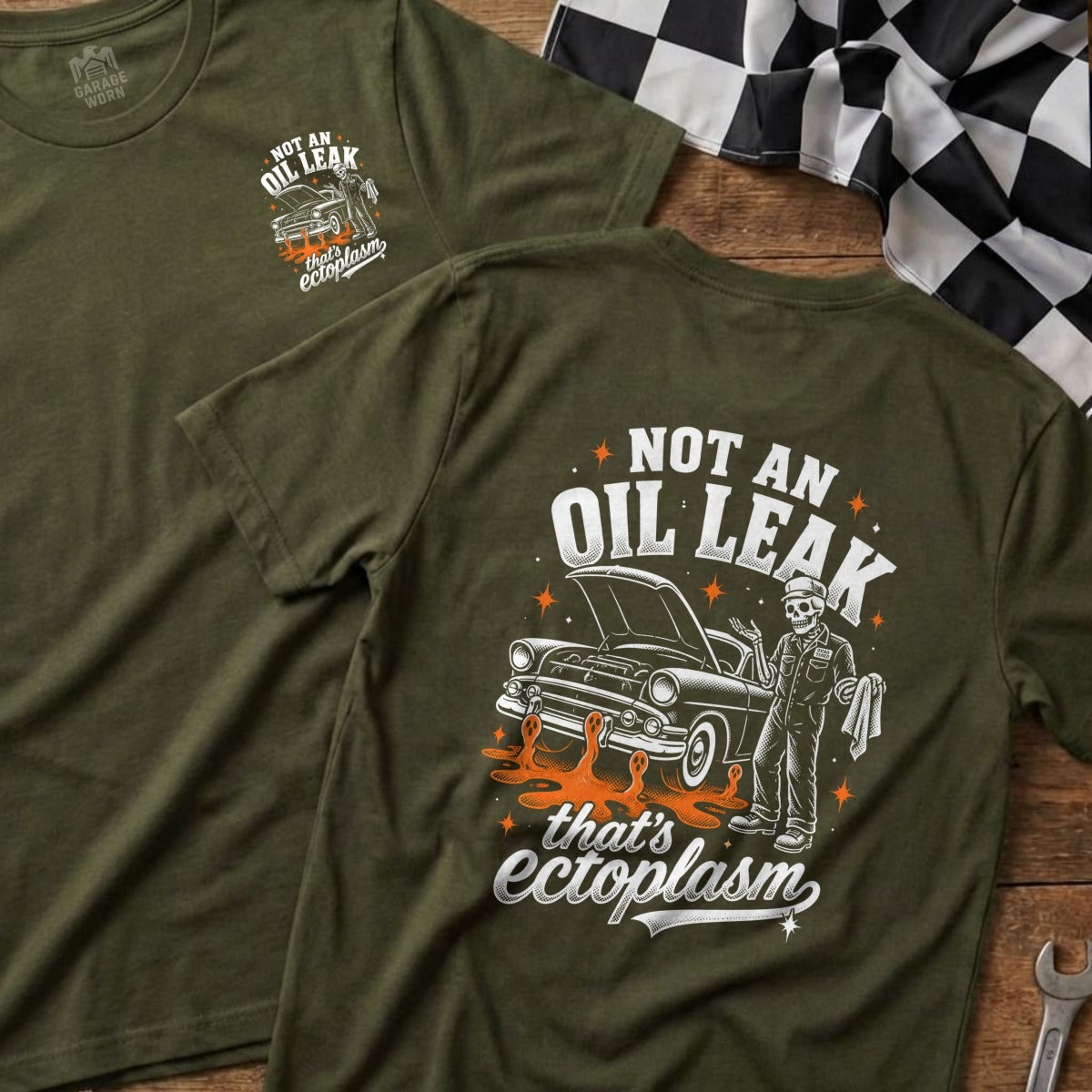Olive t-shirt with "Not an oil leak, that's ectoplasm" graphic and a skeleton mechanic.