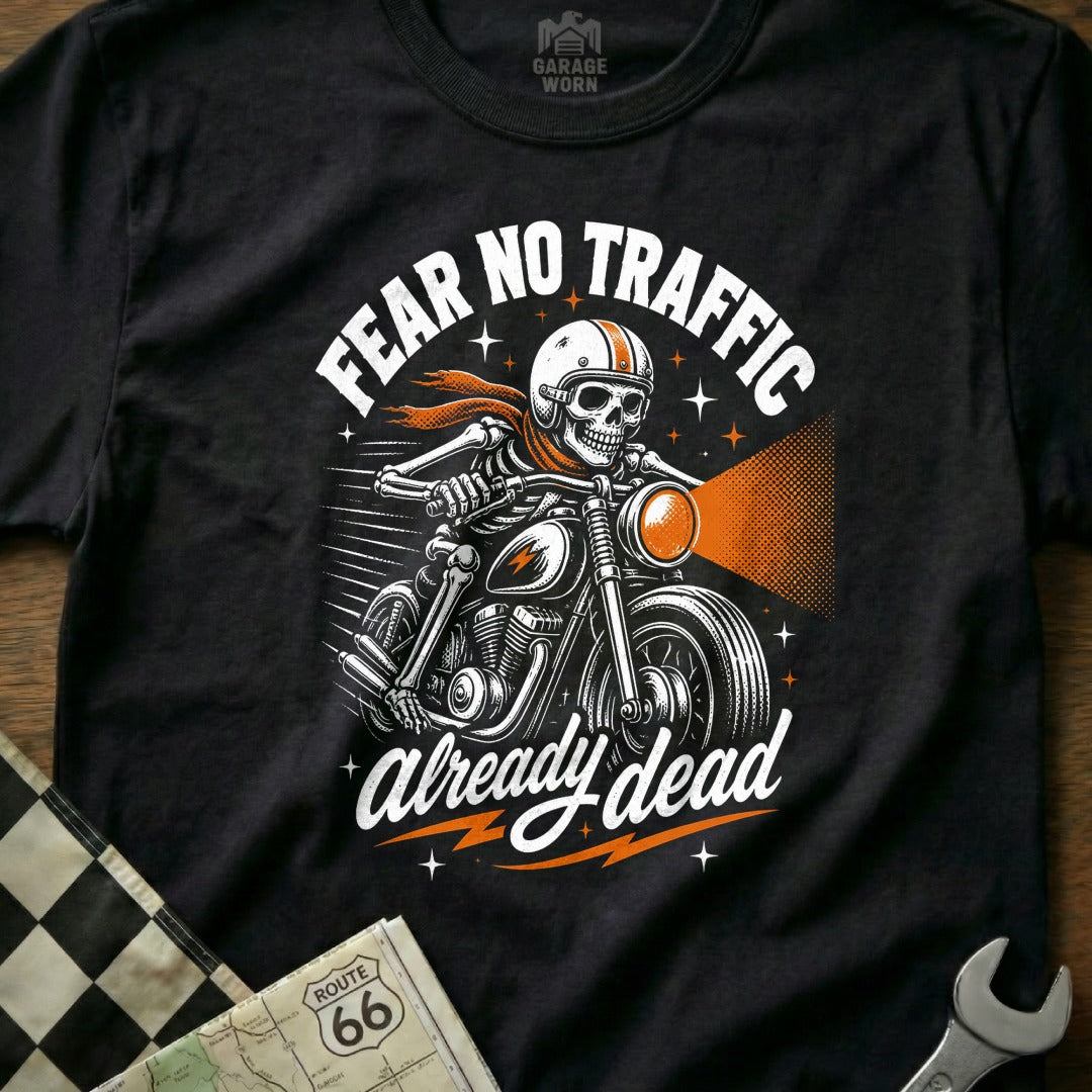 Black t-shirt graphic of a skeleton biker with text "FEAR NO TRAFFIC already dead".