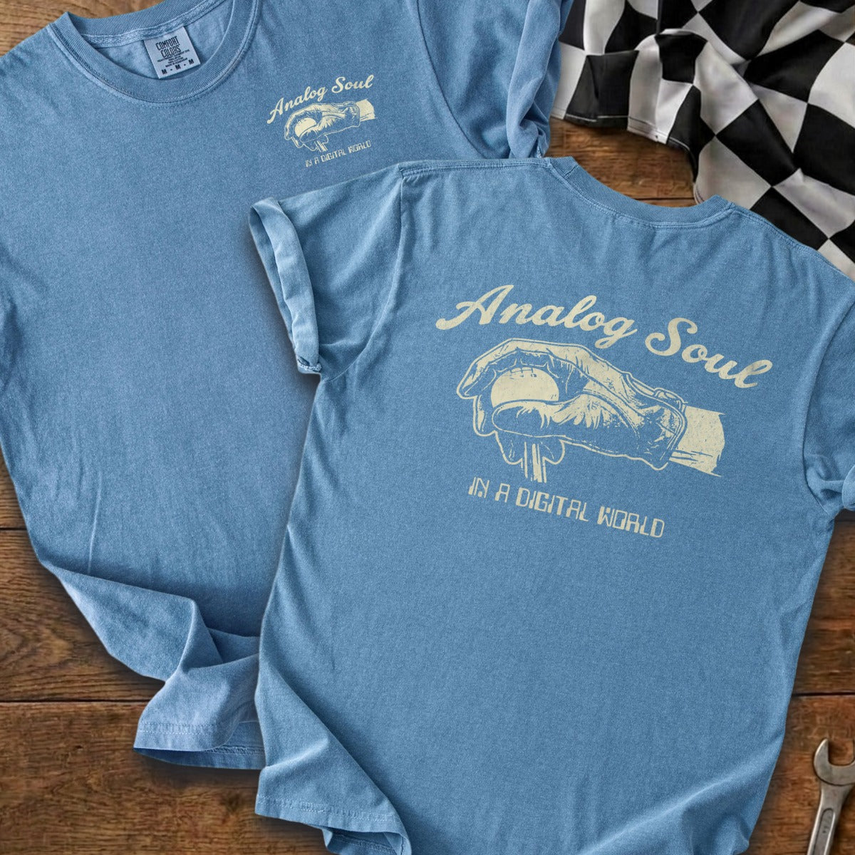 Blue t-shirt with cream graphic: "Analog Soul IN A DIGITAL WORLD" and hand holding baseball.