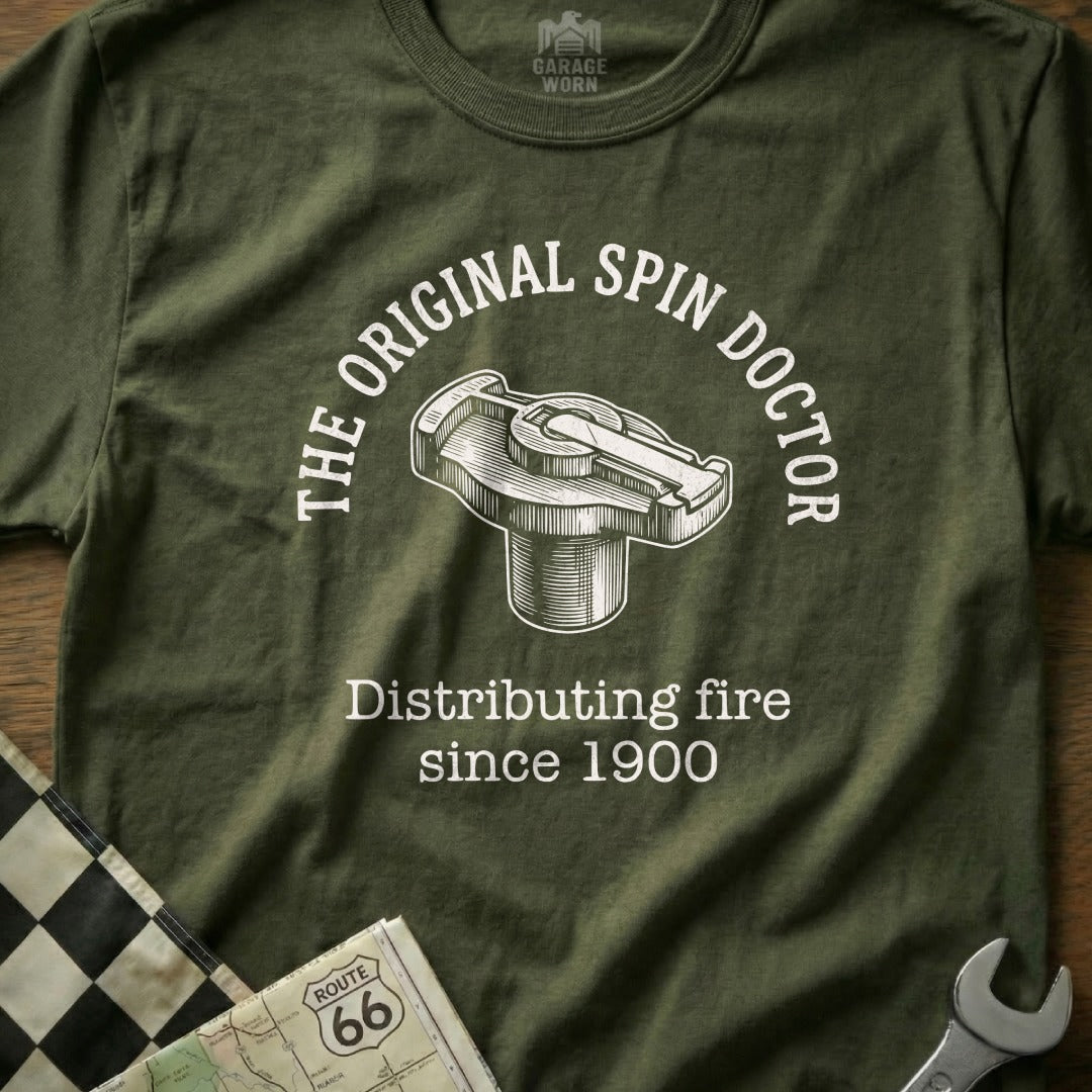 Green t-shirt with "The Original Spin Doctor" and a distributor cap graphic.