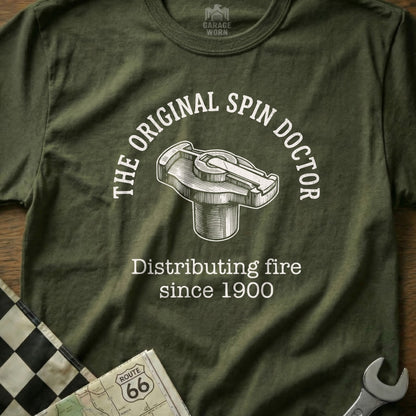 Green t-shirt with "The Original Spin Doctor" and a distributor cap graphic.