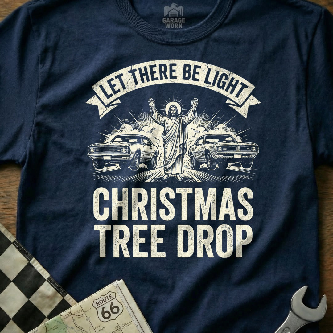 Jesus with arms raised between two muscle cars, text "Let There Be Light Christmas Tree Drop".