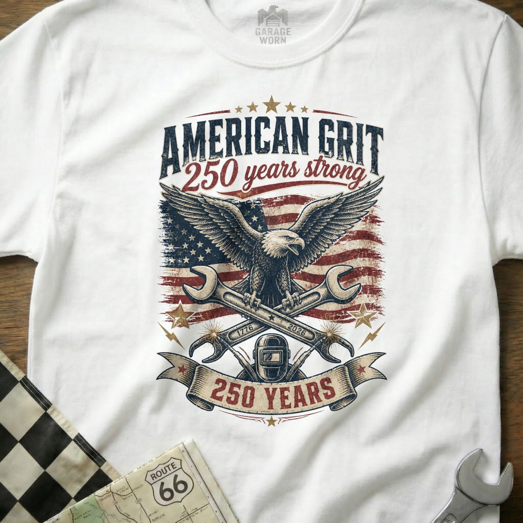 White t-shirt with "American Grit 250 years strong" text and eagle graphic.