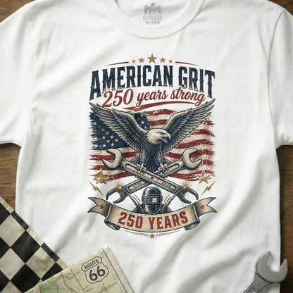 White t-shirt with "American Grit 250 years strong" text and eagle graphic.