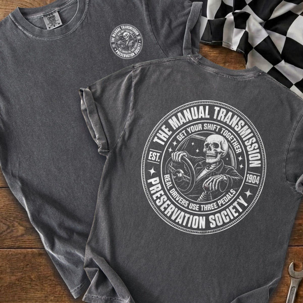 Dark grey t-shirt with "The Manual Transmission Preservation Society" graphic.