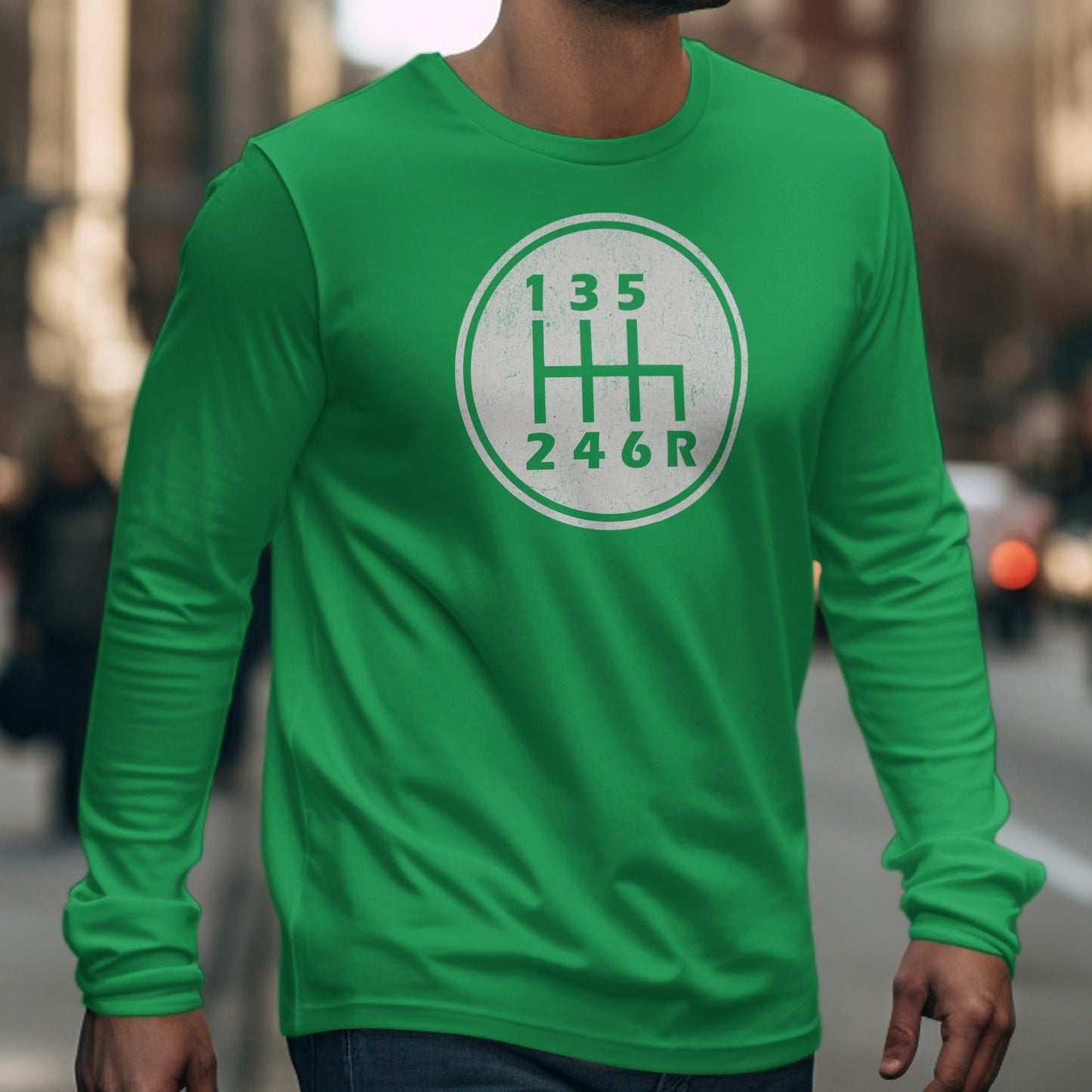 Green long-sleeve shirt with white six-speed manual transmission gear shift graphic.