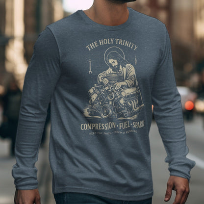 Jesus with halo working on an engine graphic on a long sleeve shirt.
