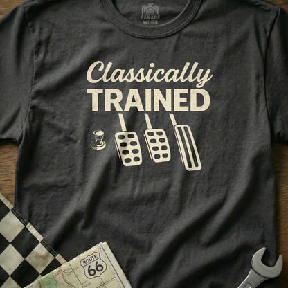 Black t-shirt with "CLASSICALLY TRAINED" and car pedals.