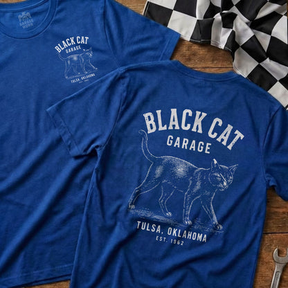 Blue t-shirt with "Black Cat Garage Tulsa, Oklahoma Est. 1962" graphic.