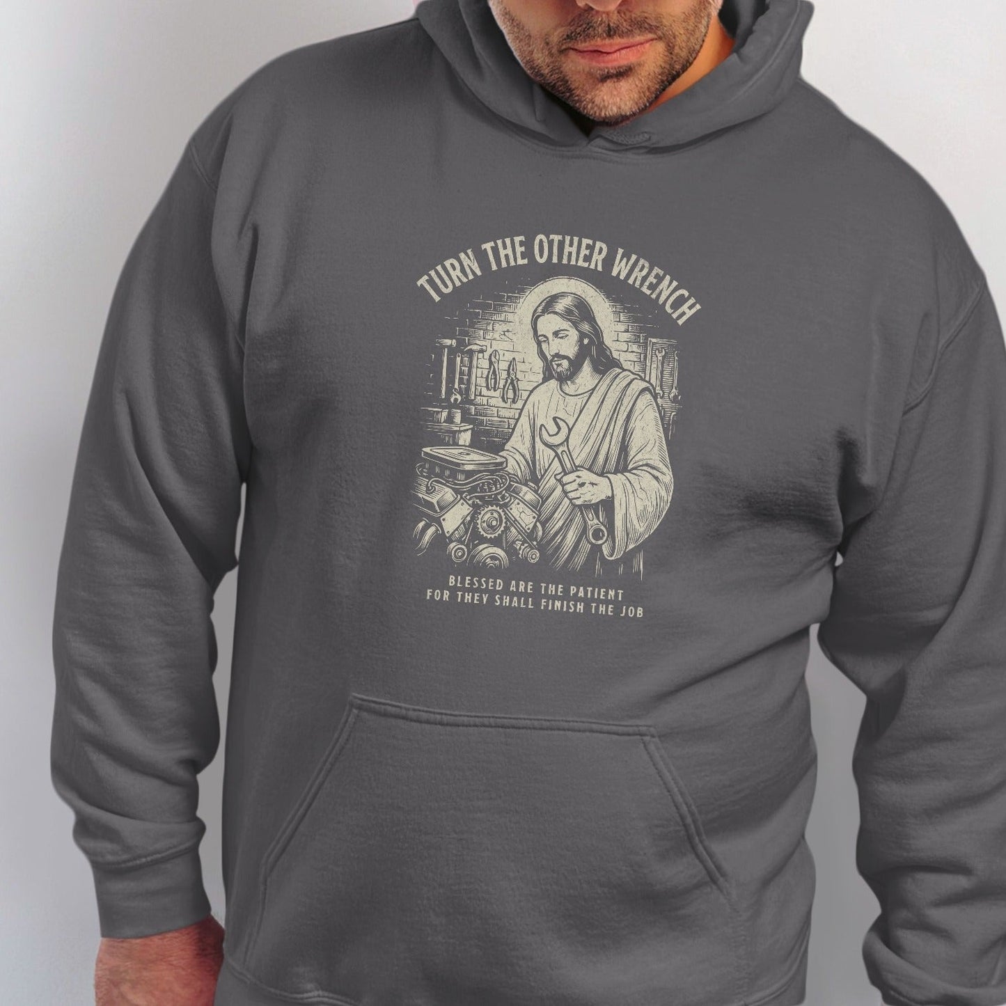 Jesus with wrench and engine, "Turn the Other Wrench" and "Blessed are the patient".