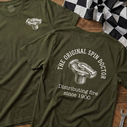 Green t-shirt with "The Original Spin Doctor Distributing fire since 1900" and rotor graphic.