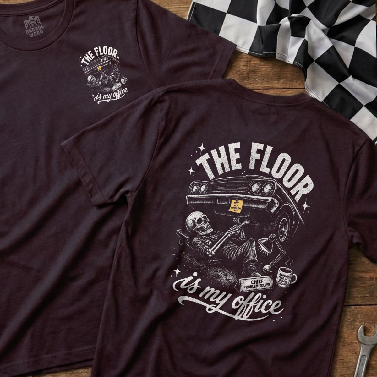 T-shirt with skeleton wrenching car, "The Floor is My Office" text.