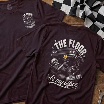 T-shirt with skeleton wrenching car, "The Floor is My Office" text.