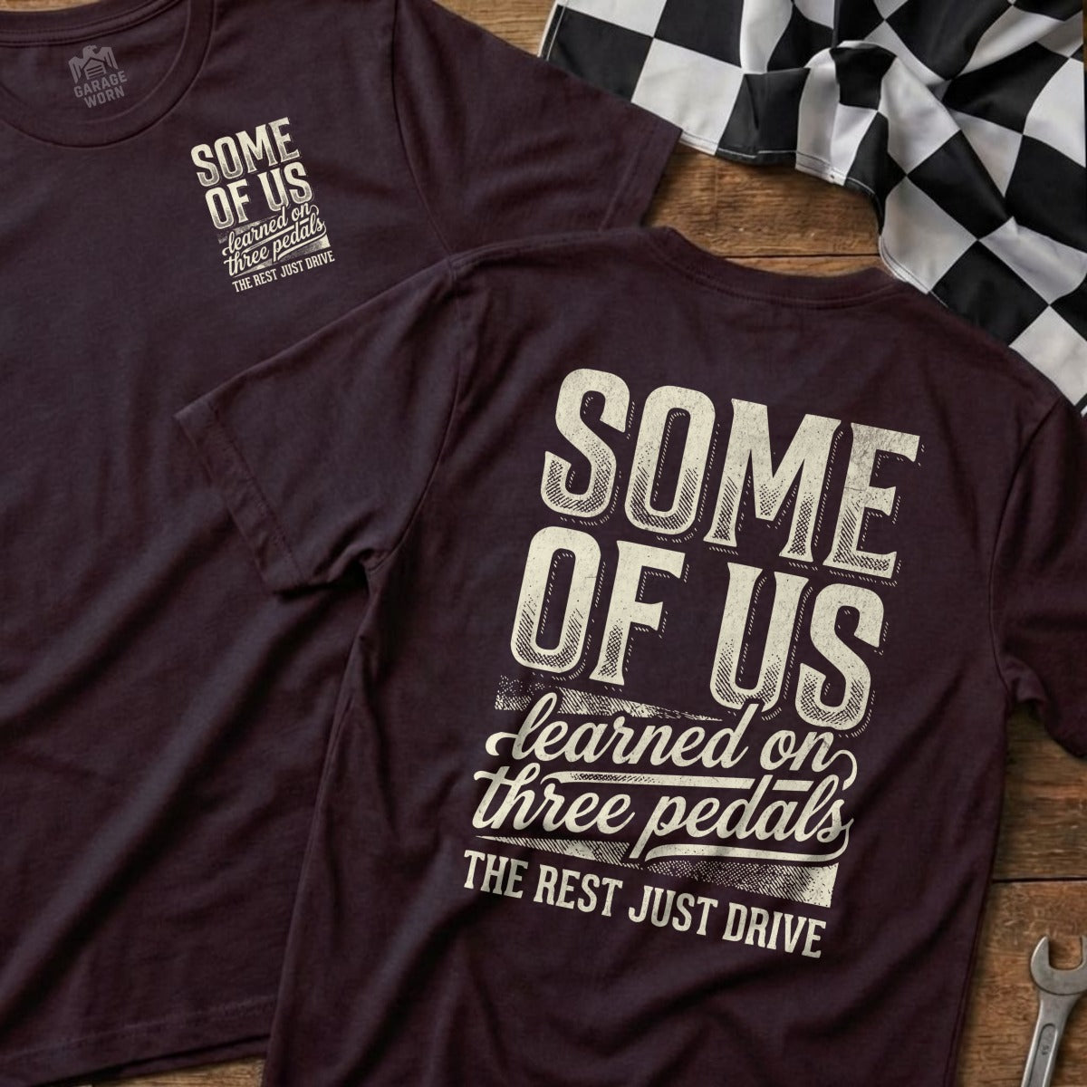 Burgundy t-shirts with "Some of Us Learned on Three Pedals The Rest Just Drive" text.