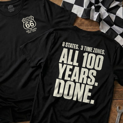 Black t-shirt with Route 66 logo and text: "8 States. 3 Time Zones. All 100 Years. Done."