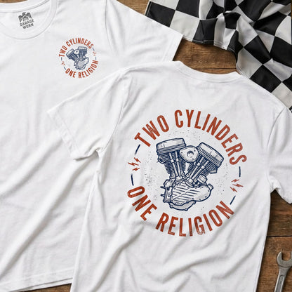 White t-shirt with a circular graphic of a V-twin engine and text "TWO CYLINDERS - ONE RELIGION".
