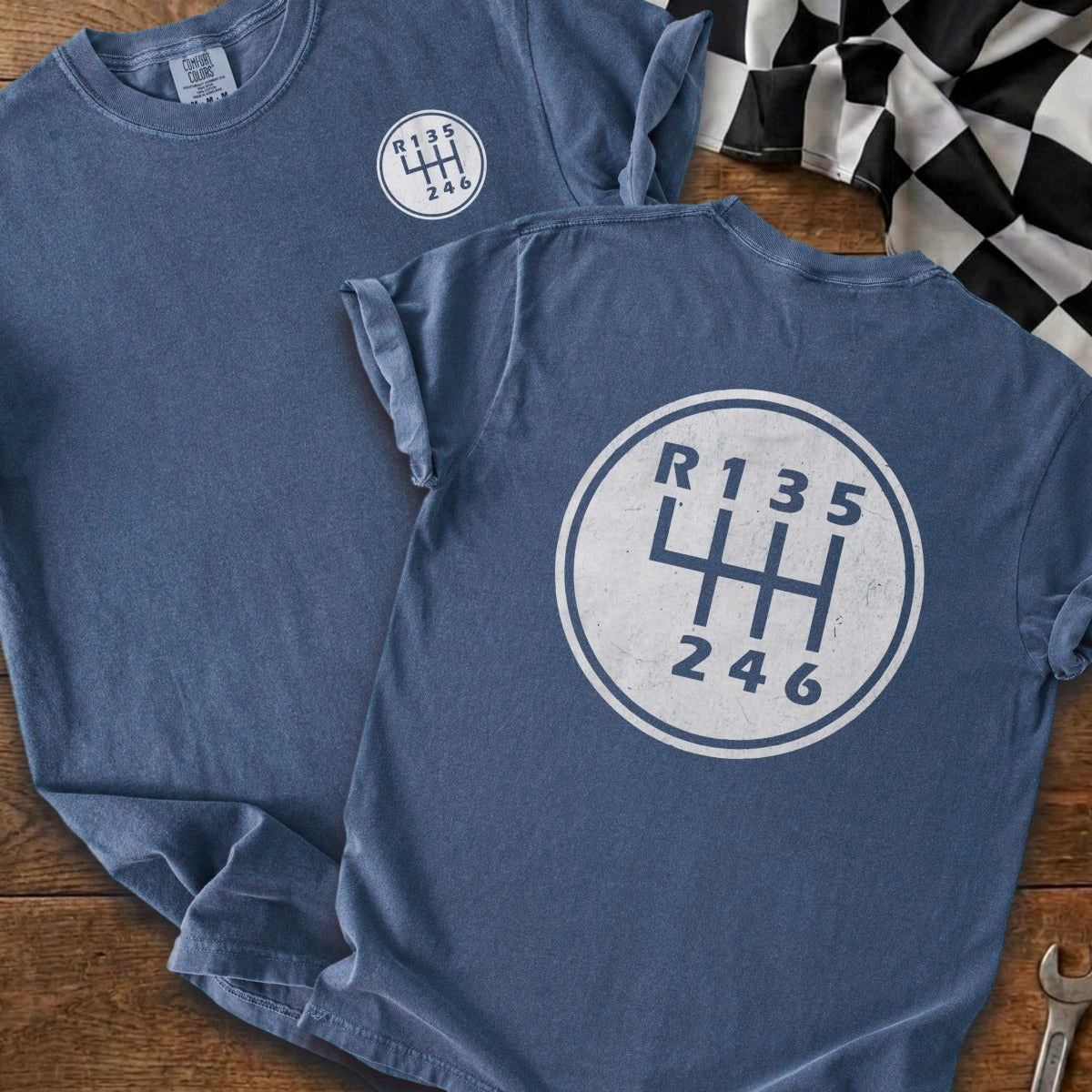 Blue t-shirts with white manual transmission shift pattern graphic.