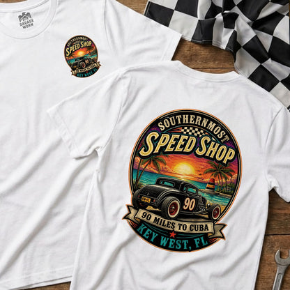 White t-shirt with "Southernmost Speed Shop" graphic featuring a hot rod at sunset.