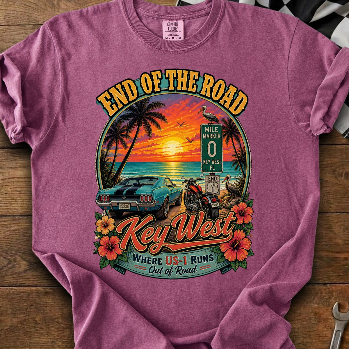 Key West graphic shirt with a vintage car, motorcycle, and sunset at the end of the road.