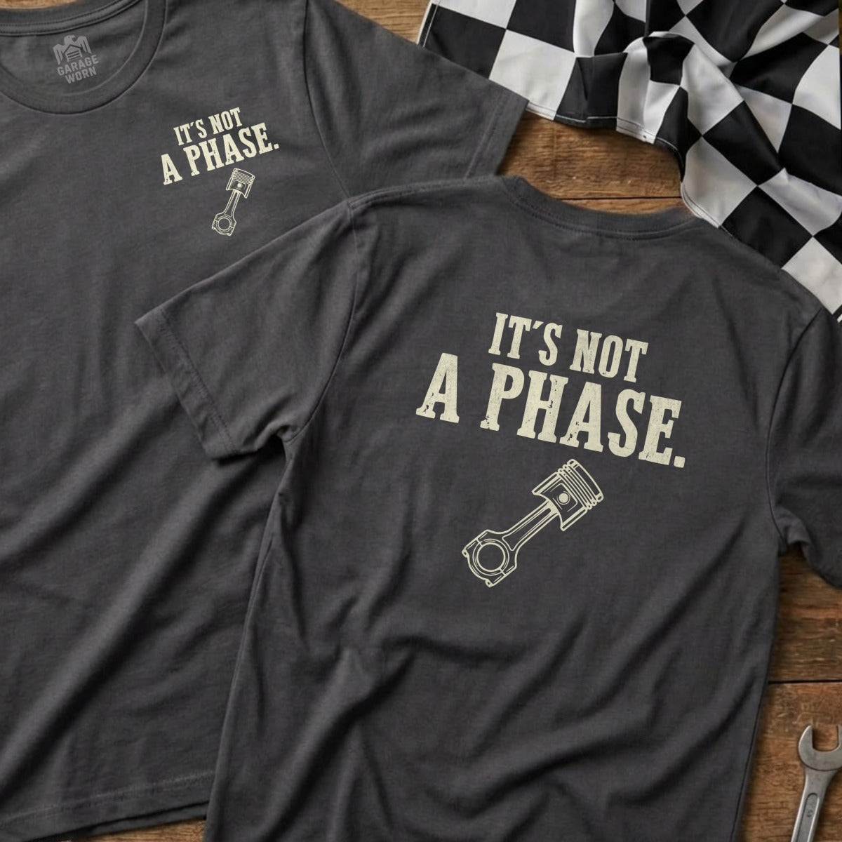 Dark gray t-shirts with "It's Not A Phase." and piston graphic.