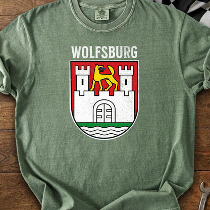Green t-shirt with Wolfsburg coat of arms: yellow wolf on castle towers.